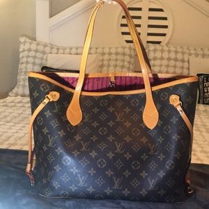 Knock off designer bag. Tote style, brown with tan monogram, honey brown strap